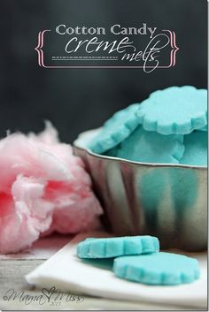 cotton candy creme muffins in a bowl with pink and blue frosting