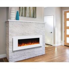 a modern fireplace in the middle of a living room