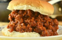 a close up of a sloppy joe sandwich on a plate