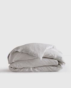 a stack of folded sheets on top of each other