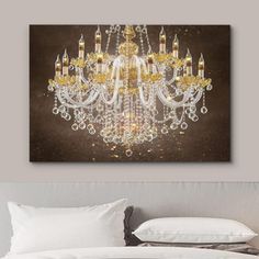 a chandelier hanging on the wall above a bed