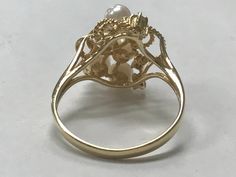 VINTAGE GORGEOUS 14K YELLOW GOLD PEARL AND DIAMOND CLUSTER RING Size 6.25 REALLY STUNNING! Ring features 6 - 3mm pearls and 3 small bright genuine diamonds! Set in solid 14K yellow gold. 2.6 grams Size 6 Please message me with any questions I am open to offers : ) Shipped insured/delivery confirmation I guarantee item to be exactly as described and pictured. Ruby Heart Pendant, Black Opal Pendant, Pearl And Diamond Ring, Initial Ring, Heart Pendant Diamond, Cute Rings, Diamond Cluster Ring, Size 10 Rings, Opal Pendants