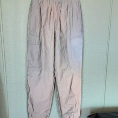 Forever 21 Women's Twill Cargo Joggers Size S,Silver, Lined Windbreaker Pants Nwt, Featuring An Elasticized Drawstring Waist, Side And Front Flap Pockets, Cuffed Hem And Baggy Fit, 100%Polyester. Made In China. 497. Flare Palazzo Pants, Brown Flare Pants, Windbreaker Pants, Flared Palazzo, Brown Flares, Velvet Flare Pants, Velvet Flares, Denim Flare Jeans, Beige Pants