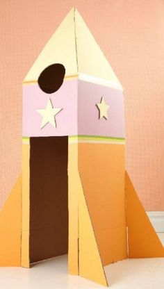 a cardboard rocket ship with stars on it