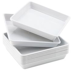 white square dishes stacked on top of each other