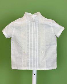 An elegant two-piece set for baby boys to wear during any special occasion. The top has a mao, or Chinese, collar, two crochet lace on the front, handmade pleats, and short sleeves; it has buttons on the back for closure. The bottom are bubble shorts with a sash of three pleats, it has buttons on the sides for closure and an elastic band on the back. The interior, or lining, is made with cotton fabric, while the exterior is with off-white linen. Dry clean 3 piece set Interior: 100% cotton; exter Elegant Short Sleeve Baptism Sets, Classic Short Sleeve Sets For Baptism, Fitted Short Sleeve Sets For First Communion, Bubble Outfit, Outfits For Baby Boys, Bubble Clothes, Bubble Shorts, Boy Baptism Outfit, Aesthetic Galaxy