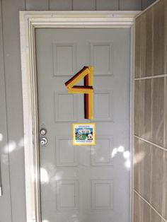 a door with the number four painted on it and a sticker in front of it