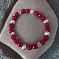 Celebrate The Season In Style With This Handmade Genuine Ruby & Herkimer Diamond Stretch Bracelet Accented With Sterling Silver Beads. The Vibrant Red Rubies And Sparkling Herkimer Diamonds Make This Bracelet A Perfect Accessory For Holiday Gatherings, New Year's Celebrations, Or Gifting To Someone Special. Designed With A Comfortable Stretch Fit To Suit Most Wrists, It's A Timeless Piece With Festive Flair. Made By Me "The Ruby" 18 (Aaa) Natural Ruby Gemstone Beads 8 Mm 4 Sterling Silver (925) Red Rondelle Gemstone Beaded Bracelets, Elegant Red Rondelle Beads, Red Ruby Beads For Gifts, Elegant Red Gemstone Beads Stretch Bracelet, Elegant Red Stretch Bracelet With Gemstone Beads, Elegant Red Round Bead Bracelets, Elegant Red Round Beaded Bracelets, Red Rondelle Gemstone Beads Bracelets, Elegant Red Stretch Bracelet With 8mm Beads