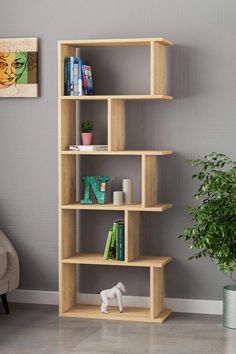 a bookshelf in the corner of a room with a potted plant next to it