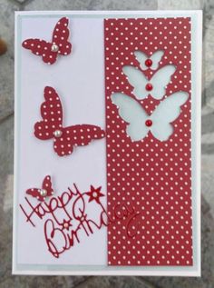 a handmade birthday card with red and white polka dots, butterflies and the words happy birthday on it