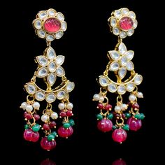 Crafting timeless masterpieces to perfection for eternity! Statement heritage earrings created with kundan stones and beautiful ruby beads. Approximate earrings length is 1.75". Gold-plated on high-quality brass as base metal. In-stock & ready-to-ship. *Please Note: We use faux stones and beads in all of our jewelry. Ruby Beads, Faux Stone, Base Metal, Ruby, Gold Plate, Plating, Brass, Beads, Stone