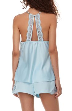 Perfect for romantic evenings, this elegant pajama set crafted in smooth matte satin includes a lace-trimmed racerback camisole and matching shorts. 2-piece set Top has V-neck; adjustable straps; open racerback; scalloped lace trim; satin construction Shorts have elastic waist; scalloped lace trim; satin construction 100% polyester Hand wash, dry flat Imported Model stats: 5'10" height, 32" bust, 25" waist, 36" hip. Model is wearing size S. Feminine Sleeveless Sleep Sets, Spring Sleeveless Night Sets, Sleeveless Night Sets For Spring, Elegant Sleeveless Sleepwear For Pajama Party, Spring Bedtime Camisole Set, Elegant Camisole Sleepwear For Pajama Party, Feminine Sleeveless Sets For Pajama Party, Elegant Sleeveless Sleep Sets, Elegant Cami Camisole For Pajama Party