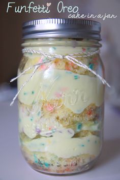 a jar filled with lots of cookies and sprinkles