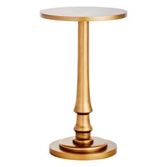 a gold table with a white top