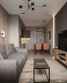 a living room filled with furniture and a flat screen tv on top of a wooden table