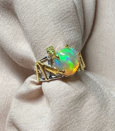 Luxury Yellow Gold Opal Ring With Accent Stones, Collectible Gold Opal Rings, Luxury Gold Multi-stone Opal Ring, Collectible Gold Opal Ring With Gemstone, Collectible Gold Opal Gemstone Ring, Luxury Hallmarked Opal Jewelry, Gold Ethiopian Opal Ring Fine Jewelry, Ethiopian Opal Gemstone Ring For Anniversary, Gift Multi-stone Opal Ring In Yellow Gold