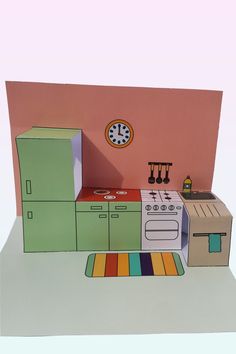 a paper model of a kitchen with an oven, stove and refrigerator in it's center