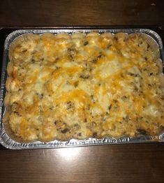 a casserole dish with cheese and other toppings