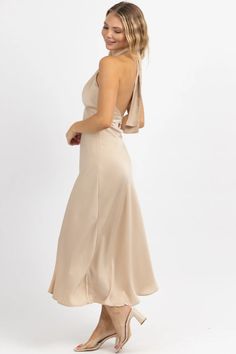 CHAMPAGNE HALTER + TIE SATIN MIDI DRESS – L'ABEYE Tie-back Midi Dress For Night Out, Midi Length Tie Back Bridesmaid Dress, Chic Tie-back Satin Dress For Wedding, Satin Backless Dress With Tie Back For Brunch, Satin Halter Dress With Tie Back For Date Night, Chic Satin Tie-back Dress For Wedding, Sleeveless Satin Backless Dress For Brunch, Bridesmaid Satin Midi Dress With Tie Back, Fitted Bridesmaid Midi Dress With Tie Back