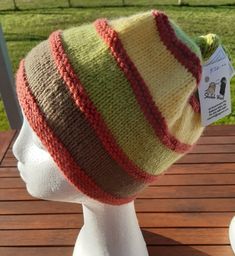 A cosy four colour child's beanie hand knitted in pure Australian Organic Wool. Knotted top. Tan, yellow, brown and lime. Matching mittens and scarf also available. Wool Beanie, Top Knot, Caps Hats, Knitted Hats, Hand Knitting, Accessories Hats, Winter Hats, Yellow, Wool