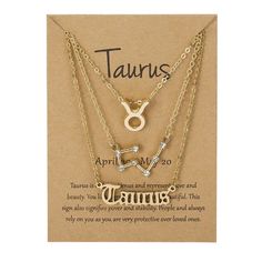 two necklaces with zodiac signs on them and the words taurus written in gold