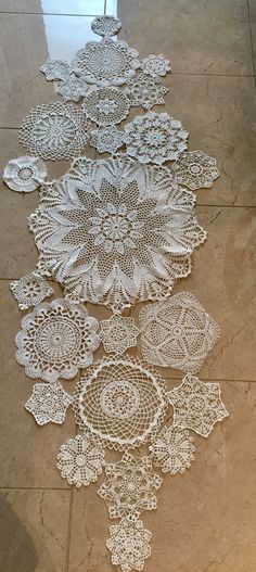 there are many crocheted doily on the floor