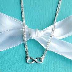 Tiffany Infinity Is A Powerful Symbol Of Continuous Connection, Energy And Vitality. The Addition Of Endlessly Looped Double Chains Echoes The Infinite Nature Of The Design. Sterling Silver On A Double 16" Chain Excellent Condition With Minimal Superficial Wear As Seen On Pictures Authentic Box/Pouch Not Included. Double Chain Necklace, Box Pouch, Infinity Pendant, Double Chain, Tiffany & Co., Womens Jewelry Necklace, Size 16, Chain Necklace, Jewelry Necklaces