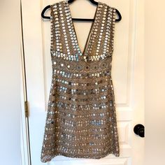 Vintage Scala Silk Mini Dress Nwt In Champgane Silver And Gold Size 6 Approx: 13” Waist 14” Ptp However, The V Cut Is Hard To Measure. Has Built In Bra! 34” Length Nwt Fully Lined Scala ($$$) Vintage Silk Silver Embellished V-neck Mini Dress, Silver Sequin Dress For Celebration, Silver Sequin Celebration Dress, Spring Metallic Embellished Dresses, Spring Festive Metallic Dress, Festive Silver Dress For Celebration, Festive Silver Celebration Dress, Silver Sequin V-neck Dress For Spring, Sleeveless Embellished Dress For Celebration