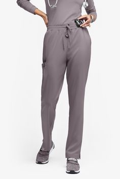 Flattering drape plus all the comfort and utility you need. These cargo pants feature a flexible elastic waist with a drawstring to perfect the fit. And you’ll love the well-placed pockets – 5 in all. Easy Stretch by Butter-Soft scrub collection is designed for a modern look and easy fit for very long shifts and made with performance 4-way stretch comfort fabric that also repels lint, fur, and hair. • Modern Fit • Natural waisted • Elastic waist • Adjustable drawcord • Total of 6 pockets • 2 sla Non-stretch Straight Leg Bottoms With Side Pockets, Gray High-stretch Elastane Bottoms, Stretch Pants With Side Pockets And 5-inch Inseam, Elastane 4-way Stretch Yoga Pants With Side Pockets, Soft Scrub, Scrub Collection, Leg Scrub, Dickies Scrubs, Gray 4-way Stretch Pants With Pockets