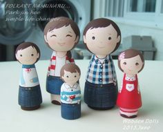 the family is made out of wooden dolls