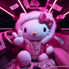 a hello kitty doll sitting in the backseat of a car with money on the floor