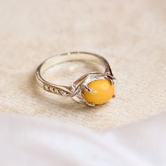 Natural Yellow Opal Women's Ring, Cabochon Oval Cut Ring Moissanite Pieces 925 Sterling Silver Ring For Women, Handmade Ring, Women's Ring. This exquisite women's ring features a captivating natural yellow opal, elegantly cut into a smooth cabochon oval and set in high-quality 925 sterling silver. Enhanced by the brilliance of moissanite accents, this ring is a true statement piece that combines timeless elegance with modern sophistication. Ring Features: Gemstones: Yellow Opal: The centerpiece of the ring is a stunning yellow opal, cut into an oval cabochon. Known for its warm, golden hues and gentle play of light, the opal exudes a soft, radiant glow that captures the eye and evokes a sense of serenity and joy. Moissanite Accents: Surrounding the central opal are sparkling moissanite pie Oval Cabochon Citrine Rings, Yellow Oval Cabochon Gemstone Ring, White Gold Oval Cabochon Promise Ring, Amber Sterling Silver Oval Cabochon Ring, Amber Sterling Silver Ring With Oval Cabochon, Amber Oval Cabochon Sterling Silver Ring, Amber Cabochon Ring For Anniversary, Yellow Oval Cabochon Ring For Gift, Yellow Cabochon Rings For Anniversary