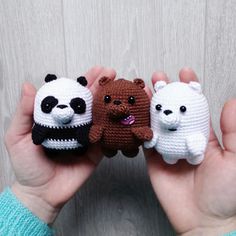 three small crocheted animals are held in their hands