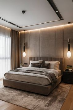 a large bed sitting in the middle of a bedroom next to two lamps on either side of it