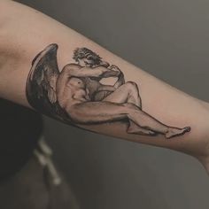 a person with a tattoo on their arm