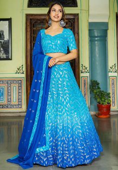 Readymade Faux Georgette Lehenga in Shaded Blue. This attire with Shantoon and Cotton Lining is Enhanced with Fancy Tassels, Resham and Sequins WorkAvailable with a Faux Georgette Blue Choli Crafted in Sweetheart Neck and Half Sleeves and a Faux Georgette Dupatta in Royal Blue. The Choli and Lehenga Lengths are 14 and 42 inches respectively. Do Note: Accessories shown in the image are for presentation purposes only. (Slight variation in actual color vs. image is possible). We sell all kinds of L Blue Sharara For Navratri Reception, Festive Semi-stitched Blue Sharara, Festive Blue Semi-stitched Sharara, Blue Sets With Dupatta In Traditional Drape, Blue Sets With Dupatta And Traditional Drape, Blue Georgette Sharara For Reception, Blue Saree Sets With Sequins, Traditional Blue Sequin Choli, Blue Semi-stitched Sets With Traditional Drape