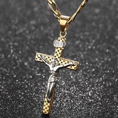 Take a moment to look at this marvelous pendant necklace handcrafted from gold plated 316L stainless steel. It showcases three-dimensional pendant in a figure of a Christian cross with one of a kind hollow diamond-shaped holes. It showcases a beautiful image of Jesus Christ in silver color. It is designed to be pressure and tough resistant by excellent professional jewelers and highly polished to achieve its desired durability.  Product highlights:   Delicately designed interlocking chain  Comfo Crucifix Necklace With Large Pendant As Gift, Gift Crucifix Necklace With Large Pendant, Large Crucifix Pendant Necklace As A Gift, Gold Cross Jewelry With Large Pendant, Gold Stainless Steel Crucifix Jewelry, Gold Stainless Steel Cross Jewelry, Jesus Christ On Cross, Jesus Cross, Gold Cross Pendant