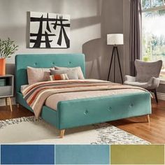 a bed room with a neatly made bed and various color swatches on the walls