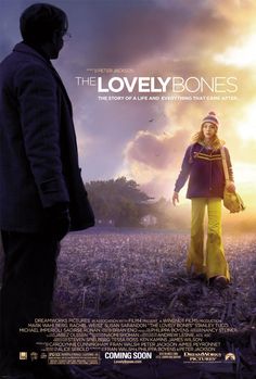 the lovely bones movie poster with a woman in yellow pants and a man standing next to her