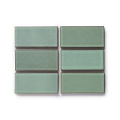 four green tiles on a white background