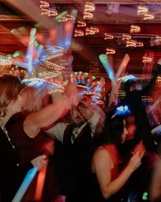 a group of people dancing at a party