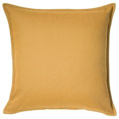 a yellow pillow on a white background