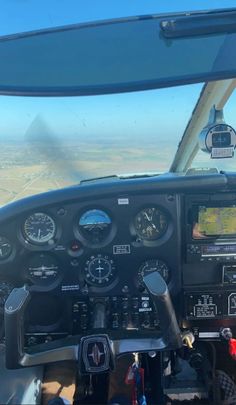 the view from inside an airplane looking out at the desert