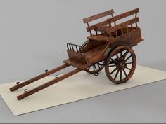 an old fashioned wooden cart with wheels on a white paper sheet that is cut out to look like it's going down the road