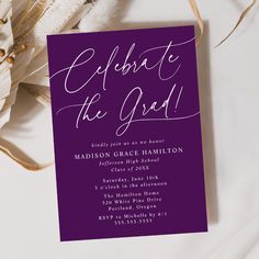 a purple and white wedding card with the words celebrate the god on it next to some dried flowers