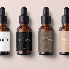 three bottles of thripy are lined up in a row on a beige background