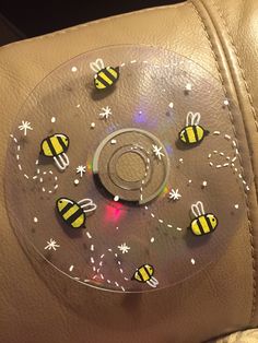 the inside of a car dashboard with bees and stars on it's glass cover