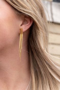 Our Tatiana Earrings, featuring a gold tassel dangle, are coming in hot, and they are going to be your new faves! They're ultra lightweight, so you can wear them all day and night without feeling weighed down - but trust us, they still pack a punch. You'll feel like you're walking down the runway every time you wear them. The playful tassel sways with every movement and adds just the right amount of flirtatious fun to your look.18k gold-plated stainless steelHypoallergenicTarnish resistantWaterp Long Gold Earrings, Light Weight Earrings, Stainless Steel Earrings, Day And Night, Winter Looks, In Hot, Dress To Impress, Plus Size Fashion, Gold Earrings