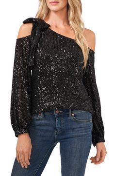 Get ready to dazzle in this sparkling, sequined top that drapes delicately from one shoulder and finishes with a feminine bow atop the other. 20" length (size Medium) Lined, except sleeves One-shoulder neck Long sleeves 97% polyester, 3% spandex Hand wash, dry flat Imported Women's Clothing Sequin Top Outfit, Sequin Blouse, Sequin Bow, Long Sleeve Sequin, Bow Blouse, One Shoulder Tops, Matching Family Outfits, Sequin Top, Dillard's