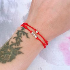 "Red String Silver Bead Bracelet Christmas Gift Birthday Gift Good Luck Bracelet New Year Gift Mens Surfer Bracelet Womens Beach Bracelet 【About this item】 ❤ This item is made of 1mm high-quality red nylon cord and sterling silver bead (4mm). It is adjustable, There are two sizes, kids size, and adult size. All the bracelets are adjustable. **Kids size: Is for wrist size 5.5\" or less **Adult size: Is for wrist size 5.5\" or more ❤ This bracelet can be worn 24hours, even in the shower. It dries Red Bracelet For Valentine's Day Birthday, Red Beaded Bracelets With Letter Beads For Birthday, Adjustable Red Bracelet For Birthday, Red Adjustable Bracelets For Birthday Gift, Red Beaded Bracelets For Birthday, Beach Bracelet, Good Luck Bracelet, Surfer Bracelets, Bracelet Christmas